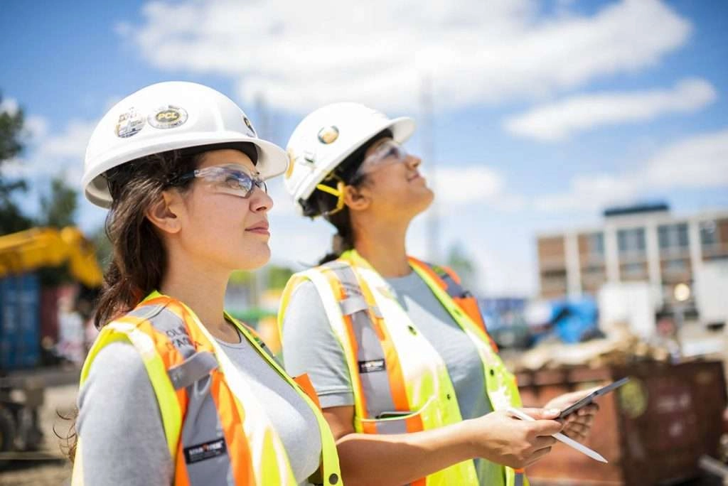 Two female construction workers with tablet
