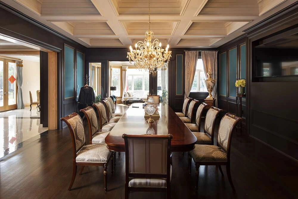 The formal dining room in this mansion is a beautiful space for hosting guests.
