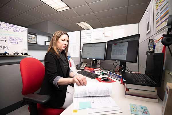 An employee working at her desk