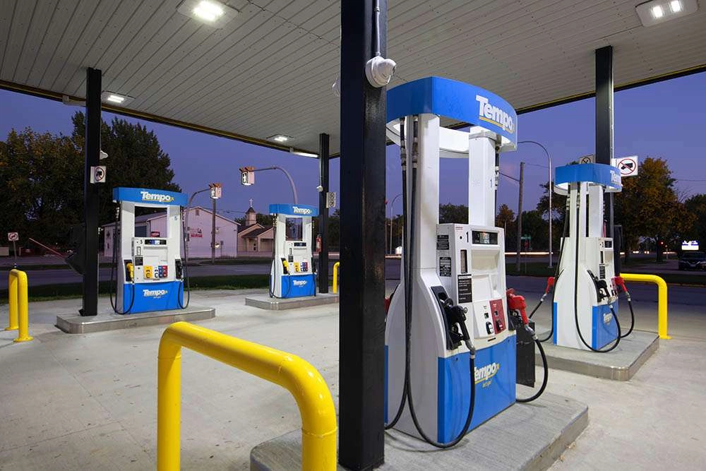 Gas pumps photographed in the early evening. © robert lowdon