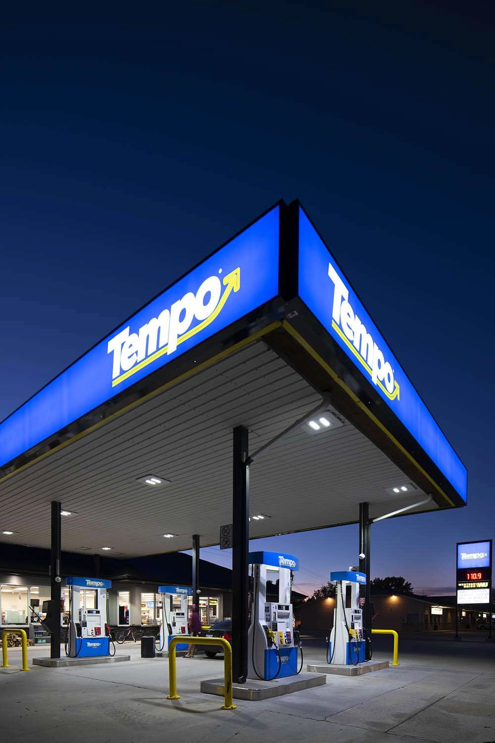 A vertical of the gas station at night. © robert lowdon