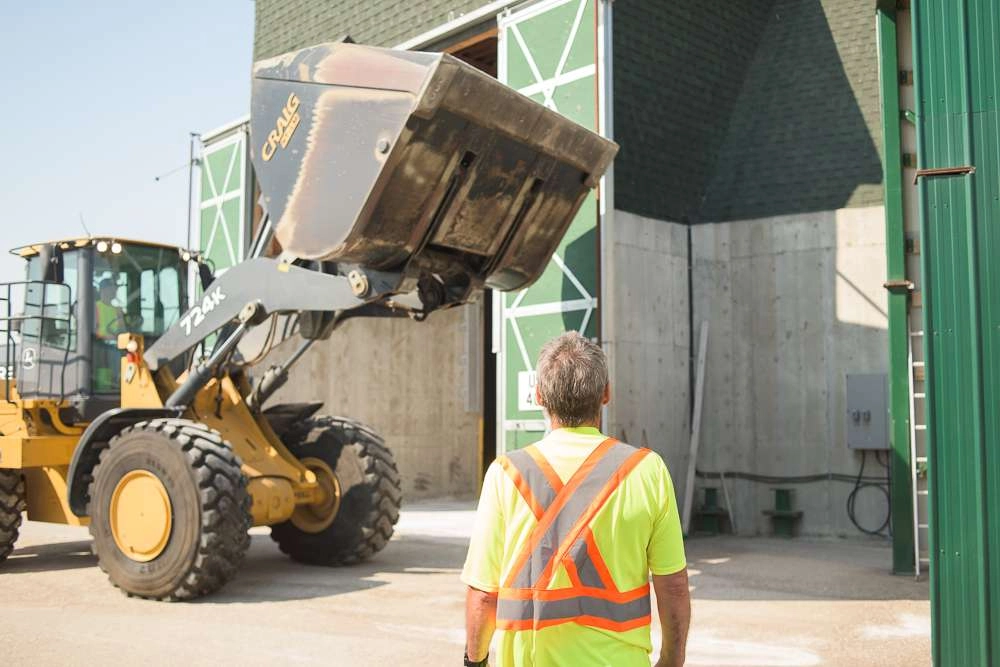 Man watches loader operate