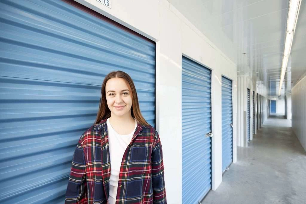 Customer smiling in front of storage locker