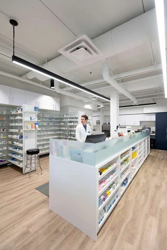 Back counter area with pharmacist.