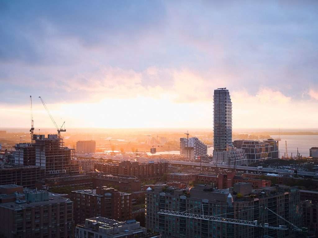 An aerial view of the toronto skyline at sunrise