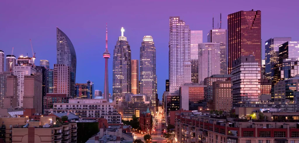 Downtown toronto skyline with tall building at early dawn night
