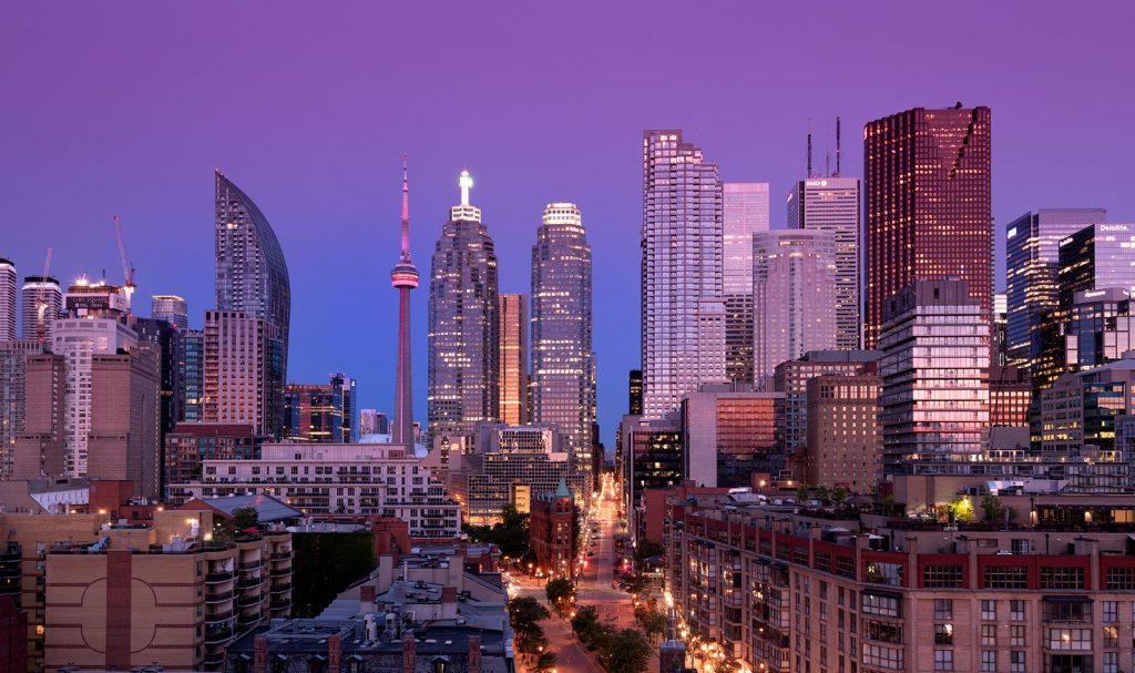 Downtown toronto skyline with tall building at early dawn night
