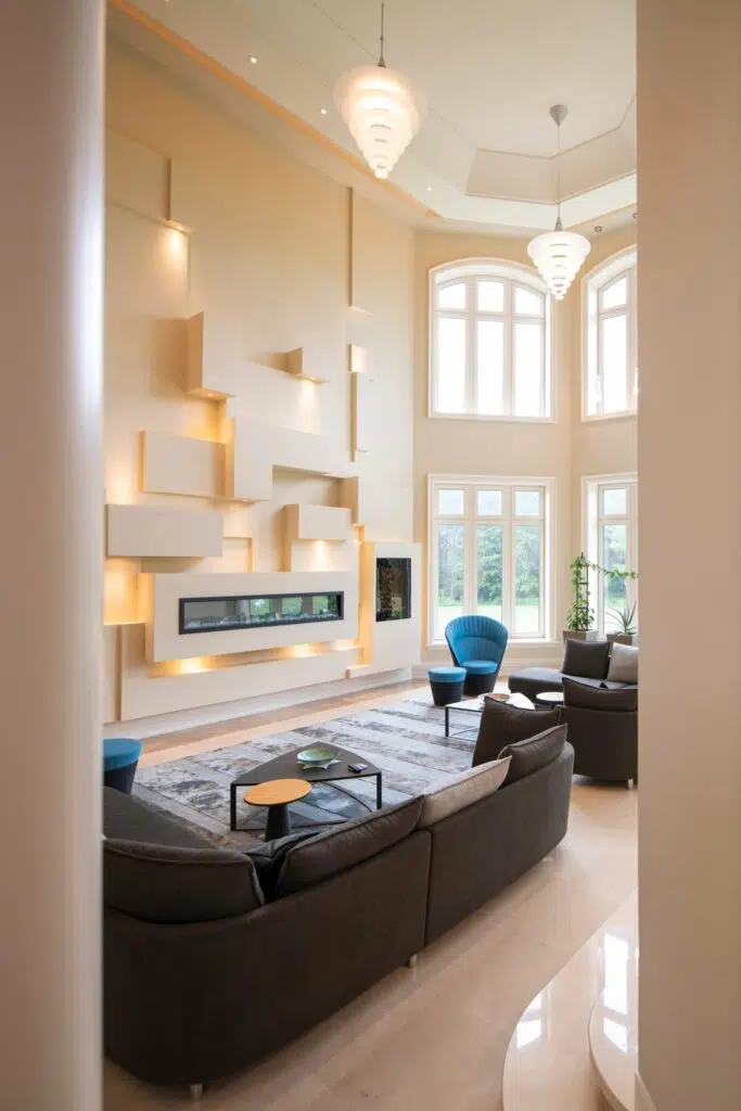 Light fixtures built into a statement wall and suspended from the ceiling in a grand living room