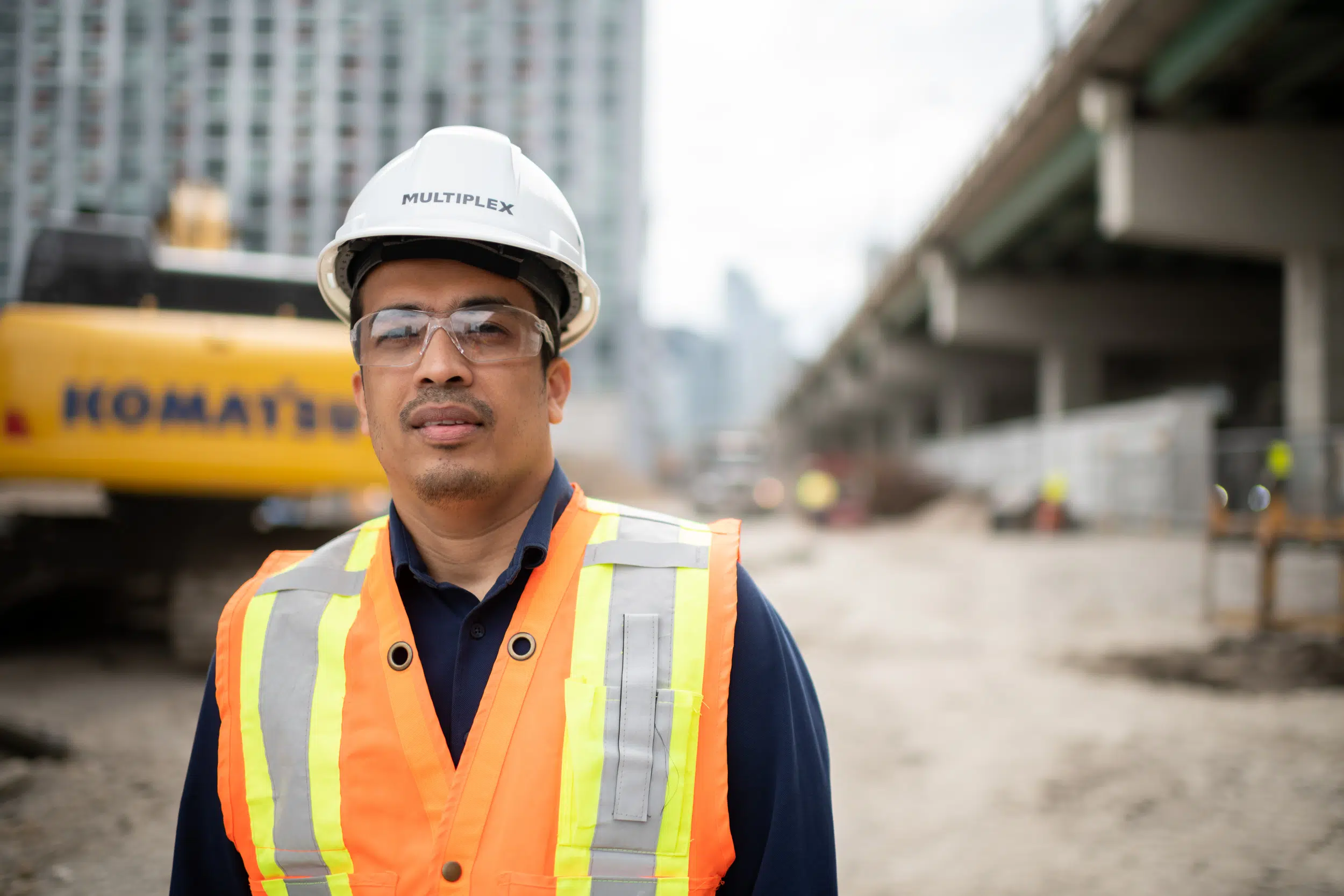 Portrait of worker at construction site in downtown toronto.