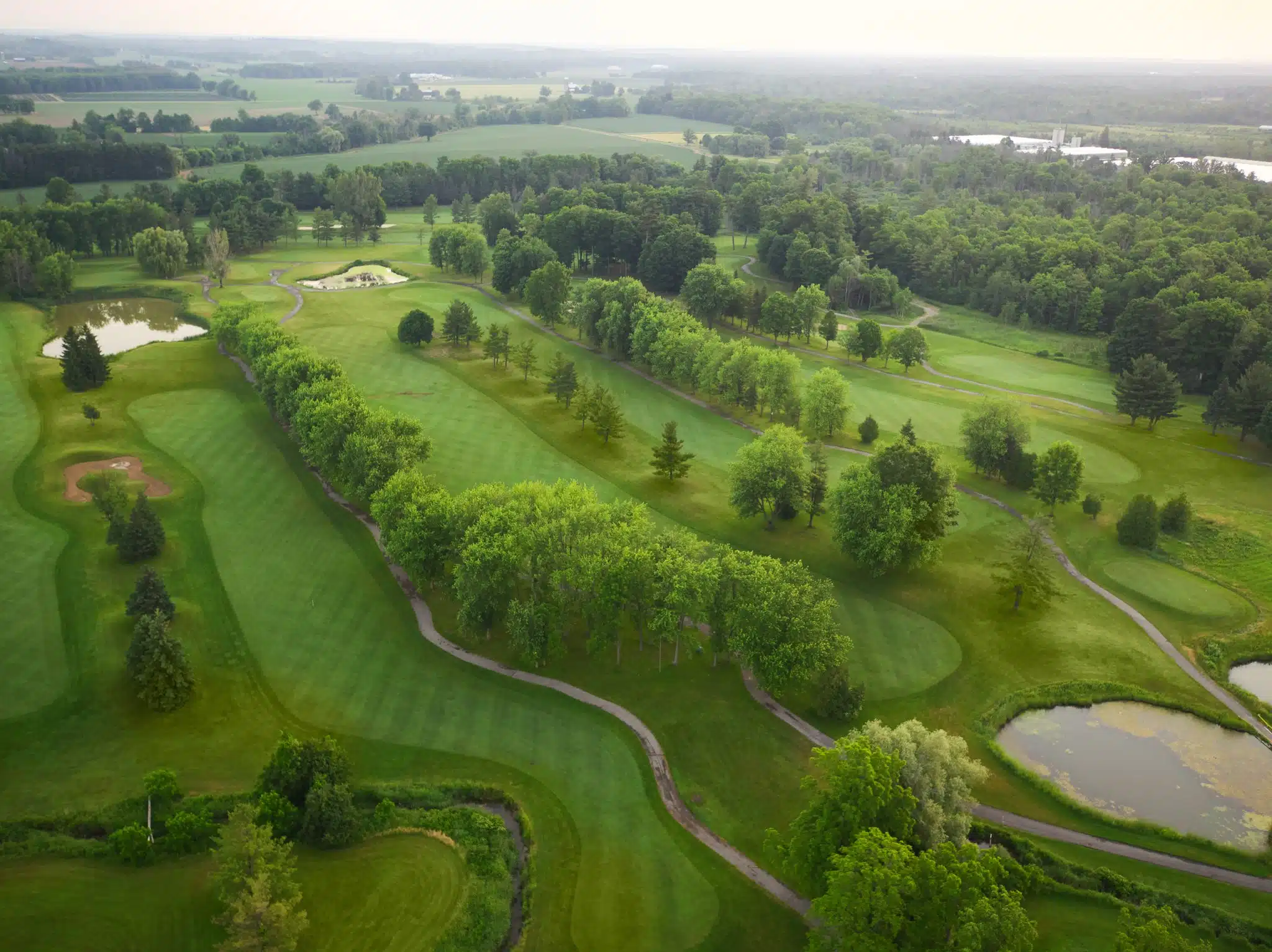 Aerial image providing an overview of a large portion of the golf course.