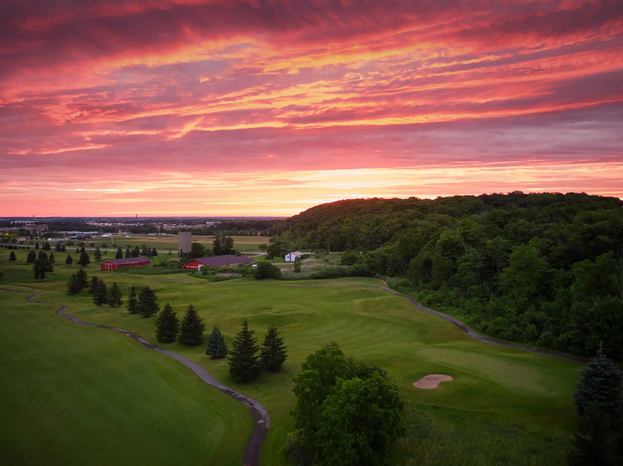 Aerial image of royal niagara golf course with vibrant red sunrise