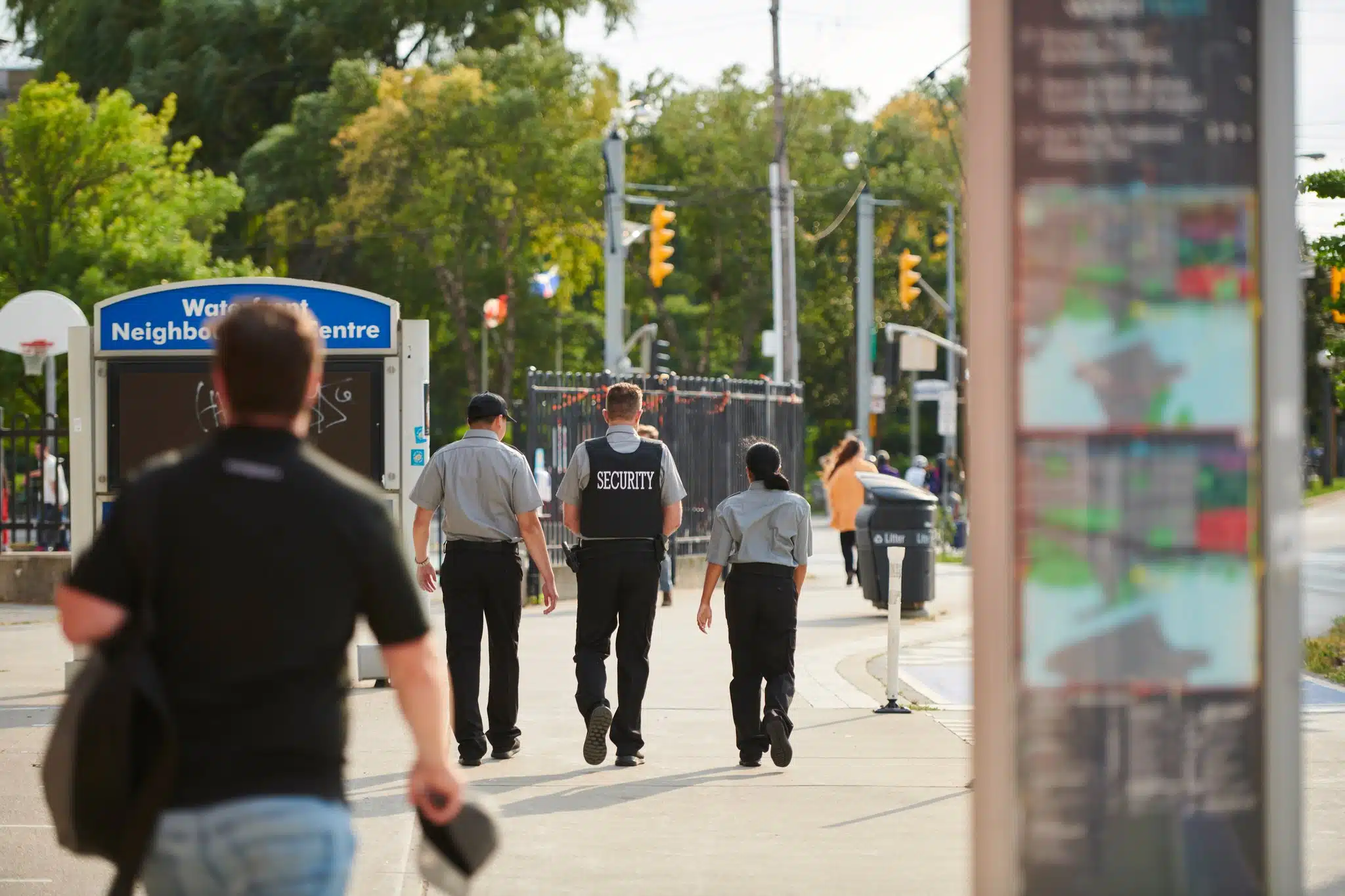 Group of security guards patrolling streets.