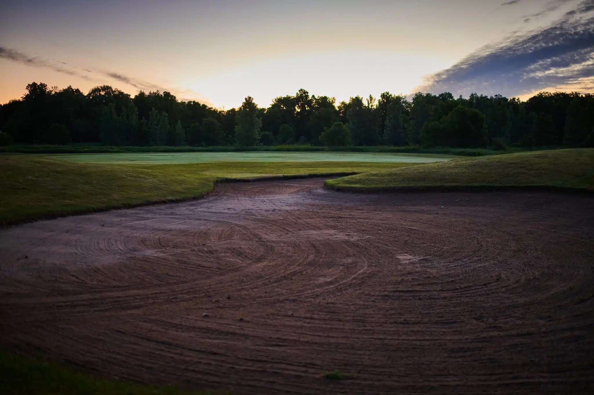 Sand trap before the sun has fully risen.