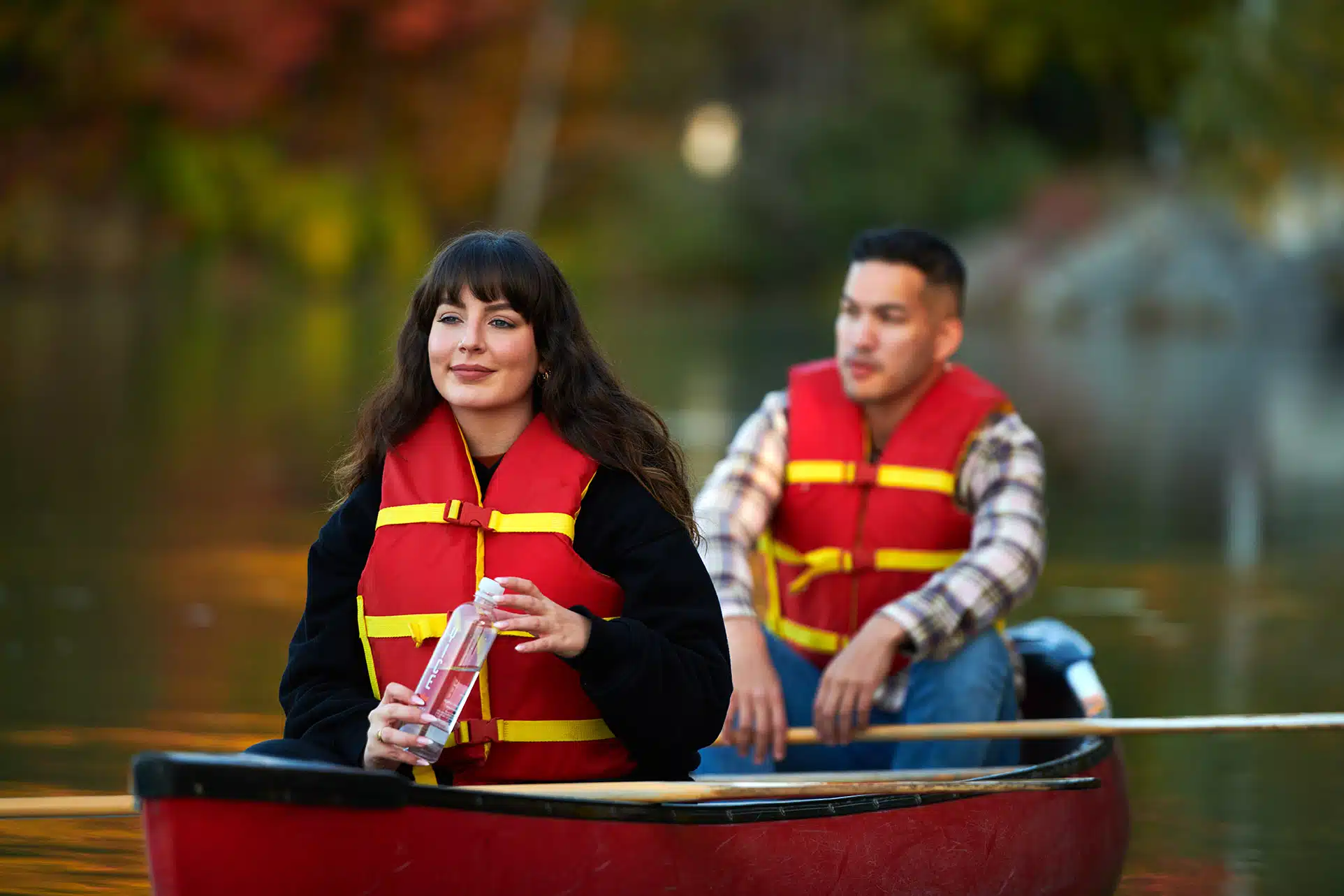 Lifestyle photography of couple in canoe