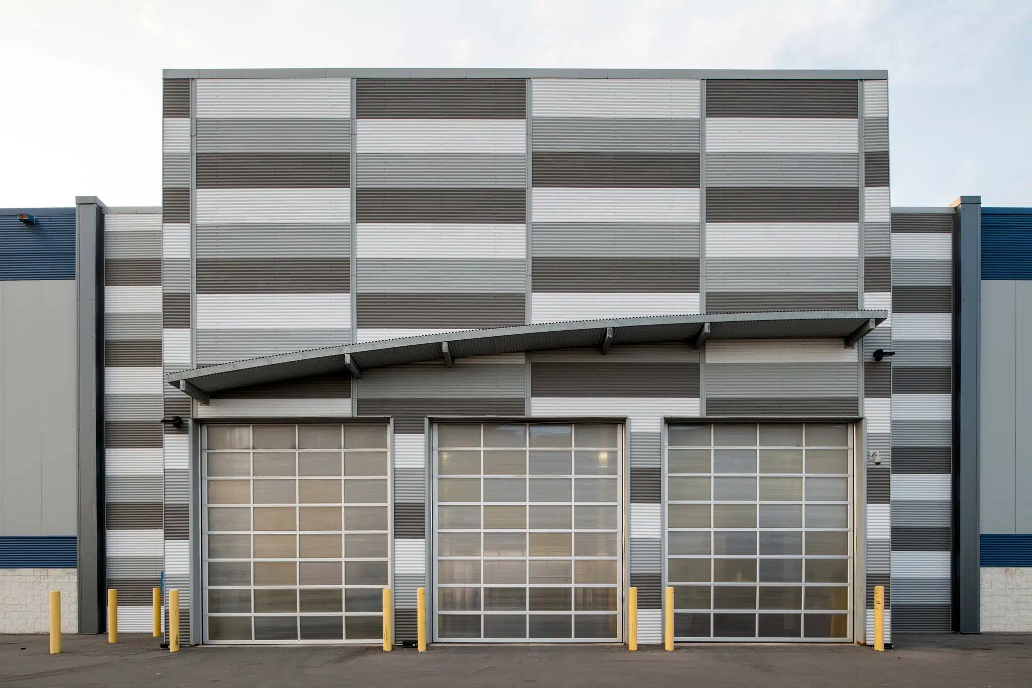 Exterior view of 3-bay drive-in temperature controlled loading dock.
